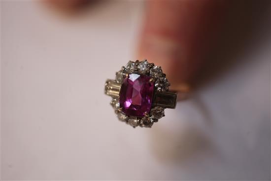 A 1940s/1950s 18ct gold, pink sapphire and diamond oval cluster ring, size O.